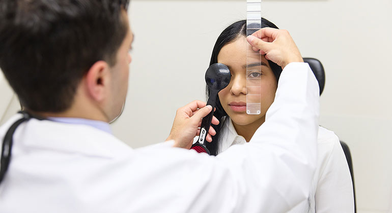 Image of doctor examining patient